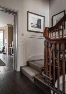Georgian staircase with bespoke panelling in a luxury heritage interior design project in Bath.
